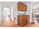 Home hallway with tile floors, built-in cabinets, and views into other rooms at 3531 E Utopia Rd, Phoenix, AZ 85050