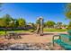 Community playground with play structure, benches, and picnic table at 3531 E Utopia Rd, Phoenix, AZ 85050