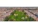 Aerial view of a community with a large green space and numerous houses at 3667 E Angstead Ct, Gilbert, AZ 85296