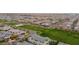 Aerial image showcasing a neighborhood with homes and a central park at 3667 E Angstead Ct, Gilbert, AZ 85296