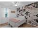 Bedroom with floral wall and a queen bed at 3667 E Angstead Ct, Gilbert, AZ 85296