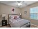 Cozy bedroom with a double bed and window coverings at 3667 E Angstead Ct, Gilbert, AZ 85296