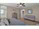 Comfortable guest bedroom with a grey sofa at 3667 E Angstead Ct, Gilbert, AZ 85296