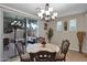 Bright dining area with table and chairs, view of backyard at 3667 E Angstead Ct, Gilbert, AZ 85296