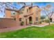 Two-story house with tan exterior, landscaping, and walkway at 3667 E Angstead Ct, Gilbert, AZ 85296