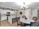 Kitchen boasts an island and white cabinetry at 3667 E Angstead Ct, Gilbert, AZ 85296