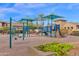 Community playground with swings, climbing structures, and shade umbrellas at 3667 E Angstead Ct, Gilbert, AZ 85296