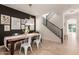 Modern dining room with a wooden table and gallery wall at 3675 E Parkview Dr, Gilbert, AZ 85295