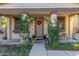 Inviting front entrance with an archway and lush greenery at 3675 E Parkview Dr, Gilbert, AZ 85295