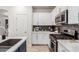 Modern kitchen with stainless steel appliances and white cabinets at 3675 E Parkview Dr, Gilbert, AZ 85295