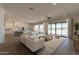 Bright and airy living room leading to a patio at 39024 N 6Th Dr, Phoenix, AZ 85086