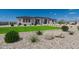 Landscaped front yard with drought-tolerant plants and rock at 39027 N 6Th Dr, Phoenix, AZ 85086