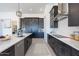 Modern kitchen with dark cabinetry and a large island at 39027 N 6Th Dr, Phoenix, AZ 85086