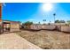 Large backyard with storage shed and brick patio at 3921 W Sharon Ave, Phoenix, AZ 85029