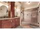 Bathroom with double vanity, granite countertops, and a large shower at 3921 W Sharon Ave, Phoenix, AZ 85029