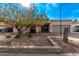 Single-story home with a gray garage door and landscaped front yard at 3921 W Sharon Ave, Phoenix, AZ 85029