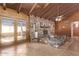 Gathering-friendly living room with a brick fireplace and tiled floors at 3921 W Sharon Ave, Phoenix, AZ 85029