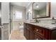 Elegant bathroom with granite vanity, tiled shower, and updated fixtures at 4017 E Wilshire Dr, Phoenix, AZ 85008