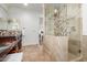 Main bathroom with granite vanity, walk-in shower, and bedroom view at 4017 E Wilshire Dr, Phoenix, AZ 85008