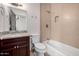 Bathroom with granite vanity and shower/tub combo at 4017 E Wilshire Dr, Phoenix, AZ 85008