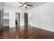 Bedroom with hardwood floors, ceiling fan, and en-suite bathroom at 4017 E Wilshire Dr, Phoenix, AZ 85008