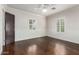 Bedroom with hardwood floors, wainscoting, and plantation shutters at 4017 E Wilshire Dr, Phoenix, AZ 85008