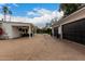 Long driveway leading to a two-car garage and backyard patio at 4017 E Wilshire Dr, Phoenix, AZ 85008