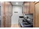 Bright laundry room with ample cabinetry and modern washer/dryer at 4017 E Wilshire Dr, Phoenix, AZ 85008