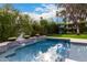 Resort-style pool with a spacious deck and lush landscaping at 4017 E Wilshire Dr, Phoenix, AZ 85008