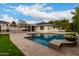 Stunning backyard oasis featuring a refreshing pool, expansive patio, and lush landscaping at 4017 E Wilshire Dr, Phoenix, AZ 85008