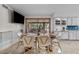 Dining area with ample seating, tile flooring, and sliding glass doors to the patio at 4024 E Hermosa Vista Dr, Mesa, AZ 85215