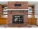 Brick fireplace and built-in cabinets in a well-lit space at 4024 E Hermosa Vista Dr, Mesa, AZ 85215