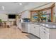 Open concept kitchen featuring stainless steel appliances, and a sunlit breakfast nook at 4024 E Hermosa Vista Dr, Mesa, AZ 85215