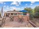 Backyard patio featuring an outdoor kitchen area with a grill and bar seating at 4024 E Hermosa Vista Dr, Mesa, AZ 85215