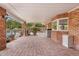 Covered brick patio with brick flooring, seating area and exterior landscape views at 4024 E Hermosa Vista Dr, Mesa, AZ 85215