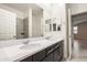 Modern bathroom with dual vanity and dark cabinets at 4125 W Bradshaw Creek Ln, New River, AZ 85087