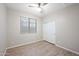 Bright bedroom with ceiling fan and wood-look floors at 4125 W Bradshaw Creek Ln, New River, AZ 85087