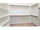 Large walk-in closet with shelving and hanging rods at 4125 W Bradshaw Creek Ln, New River, AZ 85087