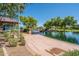 Scenic walking path alongside a peaceful lake in a community park at 4125 W Bradshaw Creek Ln, New River, AZ 85087