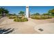 Community monument with flagpole and surrounding flowerbeds at 4125 W Bradshaw Creek Ln, New River, AZ 85087