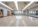 Large dance studio with wood floors, mirrors, and multiple ceiling fans at 4125 W Bradshaw Creek Ln, New River, AZ 85087