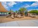 Modern playground with slides, climbing structures, and shade structures at 4125 W Bradshaw Creek Ln, New River, AZ 85087