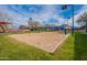 Sand volleyball court with surrounding grass at 4125 W Bradshaw Creek Ln, New River, AZ 85087