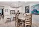 Rustic dining table with four chairs in an open concept space at 4134 E Pinto Dr, Gilbert, AZ 85296