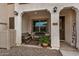 Inviting front porch with a bench and potted plants at 4134 E Pinto Dr, Gilbert, AZ 85296