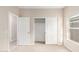 Bedroom with closet and doors to hallway at 414 E Eason Ave, Buckeye, AZ 85326