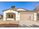 Newly constructed home with a two-car garage and neutral color palette at 414 E Eason Ave, Buckeye, AZ 85326