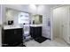 Bathroom with double vanity, marble countertops and a walk-in shower at 41703 W Mesquite Rd, Maricopa, AZ 85138