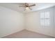 Bright bedroom with window and neutral carpet at 41703 W Mesquite Rd, Maricopa, AZ 85138