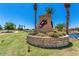 Attractive community entrance with landscaping and water feature at 41703 W Mesquite Rd, Maricopa, AZ 85138